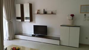 a living room with a television on a counter at Apartments Jani in Hvar