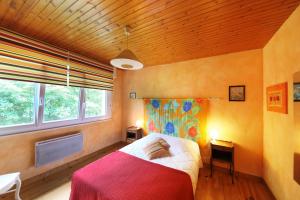 Postel nebo postele na pokoji v ubytování Chalet en Couleurs