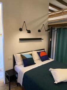 a bedroom with a large bed with two pillows at Borgo Portello in Padova