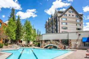 a swimming pool in front of a building at Shoshone Condos at Big Sky Resort in Big Sky