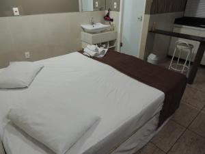 เตียงในห้องที่ Hotel BH Inn Palmares - By UP Hotel - Acesso Cristiano Machado