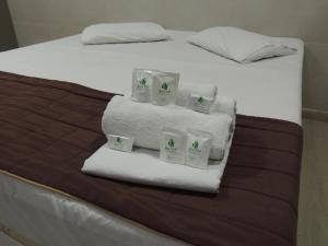 เตียงในห้องที่ Hotel BH Inn Palmares - By UP Hotel - Acesso Cristiano Machado