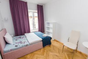 Postel nebo postele na pokoji v ubytování Апартаменти в центрі міста