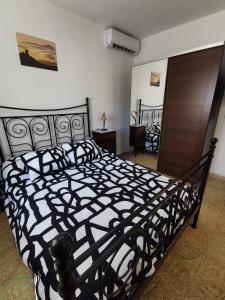 Postel nebo postele na pokoji v ubytování Casa rural Juan y Juana Canino