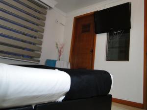 Postel nebo postele na pokoji v ubytování Hotel Esmeralda Plaza