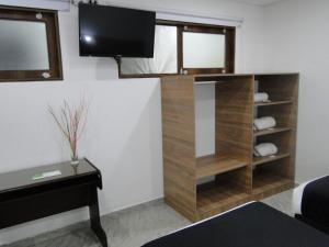 TV a/nebo společenská místnost v ubytování Hotel Esmeralda Plaza
