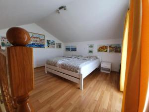 Postel nebo postele na pokoji v ubytování Apartments Podlesek