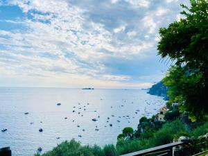 a large body of water with boats in it at Positano's Flats in Positano