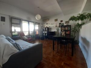 a living room with a couch and a table at Colombo & Stadium Cozy Flat in Lisbon