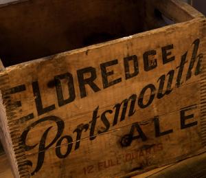 a wooden crate with a sign that reads tobacco prohibitionale at The Bow Hotel in Portsmouth
