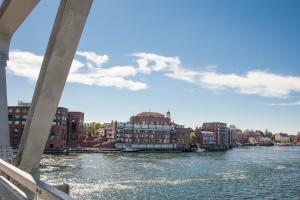 a view of a river with buildings and a bridge at The Bow Hotel in Portsmouth