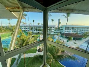 a view from the window of a resort at Ancorar Flat Porto de Galinhas-Flat 3311-3314 in Porto De Galinhas
