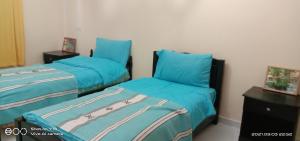 Ένα ή περισσότερα κρεβάτια σε δωμάτιο στο Blue Waves apartment
