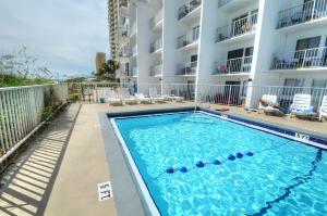 a swimming pool in front of a apartment building at Blue Haven Villa in Panama City Beach