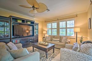 a living room with two couches and a tv at Marco Island Home with Pool and Lanai Less Than 1 Mi To Beach in Marco Island