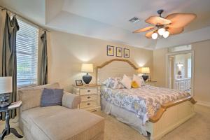 a bedroom with a bed and a chair at Marco Island Home with Pool and Lanai Less Than 1 Mi To Beach in Marco Island +26 photos