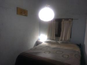 
Una cama o camas en una habitación de Mamacha Tatai
