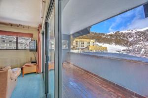 a balcony with a view of a snow covered mountain at Snow Ski Apartments 41 in Falls Creek