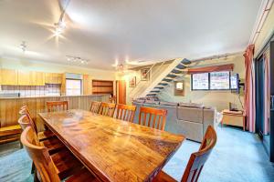 a dining room with a wooden table and chairs at Snow Ski Apartments 41 in Falls Creek