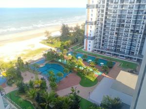 an aerial view of a building and the beach at Timurbay Lavender Homestay in Kampung Sungai Karang