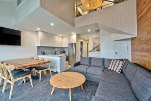 a living room with a couch and a table at Snow Ski Apartments 32 in Falls Creek