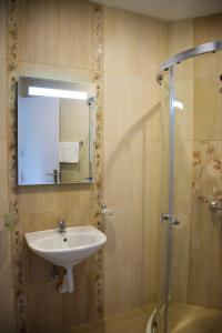 a bathroom with a sink and a shower at studio ASI in Obzor