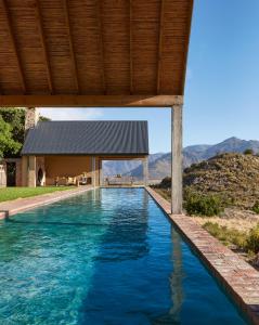 a swimming pool in the backyard of a house at 7 Koppies in Franschhoek