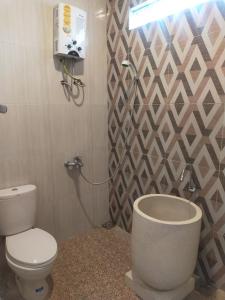 Koupelna v ubytování Villa keluarga Pandansari