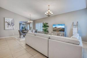 a living room with a couch and a dining room at Casa De Arbol in El Paso