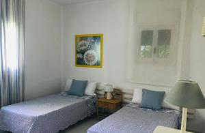 A bed or beds in a room at Casa Playa