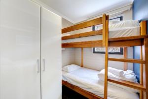 a bunk bed in a tiny house at Snow Ski Apartments 26 in Falls Creek