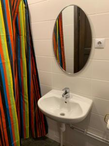 a bathroom with a sink and a mirror at Delta 6 two big beds in Tartu +16 photos