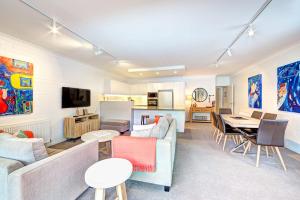 a living room with a couch and a table at Snow Ski Apartments 39 in Falls Creek