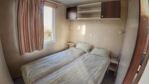 Postel nebo postele na pokoji v ubytování Triocamp Praha