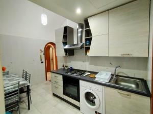 A kitchen or kitchenette at Casa Emanuele