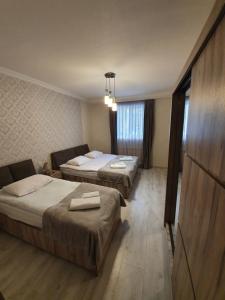 A bed or beds in a room at Kazbegi Guide
