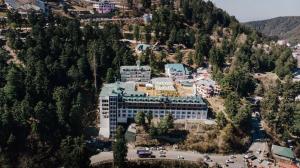 an aerial view of a building on a mountain at Royal Tulip Luxury Hotel, Kufri, Shimla in Shimla