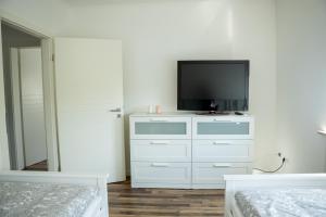 Postel nebo postele na pokoji v ubytování Schöne Ferienwohnung in Oberkotzau am Fichtelgebirge