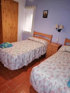 Postel nebo postele na pokoji v ubytování Casa Cartujet