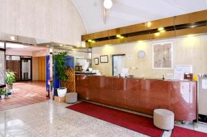 a lobby of a hospital with a reception desk at Sky Heart Hotel Kawasaki in Kawasaki