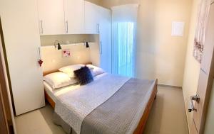 Posteľ alebo postele v izbe v ubytovaní Apartment Lucie 4 + 10 fotografií