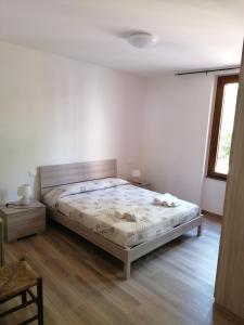 Ένα ή περισσότερα κρεβάτια σε δωμάτιο στο Le camelie