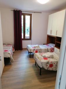 Ένα ή περισσότερα κρεβάτια σε δωμάτιο στο Le camelie