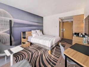 Posteľ alebo postele v izbe v ubytovaní Novotel Katowice Centrum