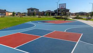 a basketball court in a park with a basketball hoop at Botanical Guest House in Mickleham +1 photo