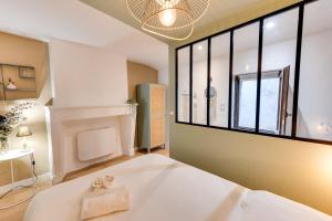 Ένα ή περισσότερα κρεβάτια σε δωμάτιο στο L'Atelier Filaterie - Apartment for 2 people +4 φωτογραφίες