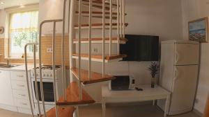 TV a/nebo společenská místnost v ubytování Apartments Podlesek