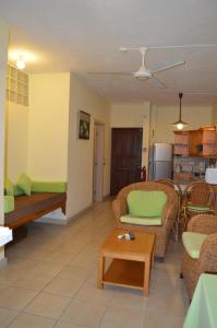 a living room with a couch and a table at Maurer Loisirs Ltee in Trou aux Biches