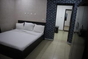 Ein Bett oder Betten in einem Zimmer der Unterkunft Events & Suites