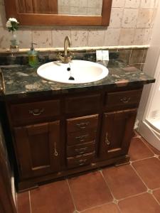 a bathroom with a sink and a counter at La venta el Membrillo in Membrío